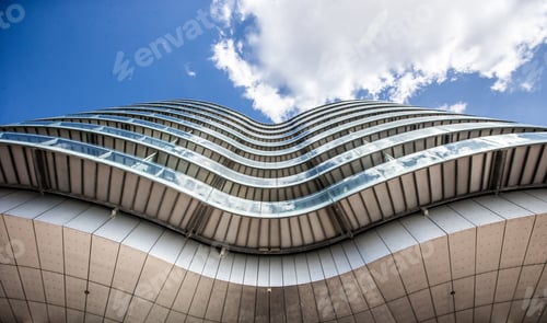 Vista previa: Toma de ángulo bajo de los edificios de Gemini Residence con un cielo azul de fondo