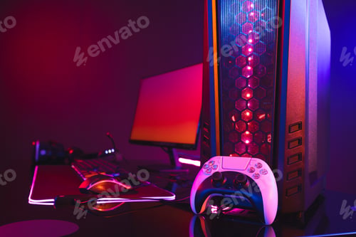 Preview: Composite of computer with video game accessories with copy space on neon background