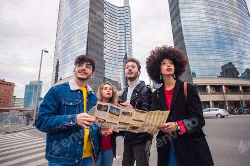 Preview: Group of foru friends traveler consulting guide map planning holiday outdoors visiting city
