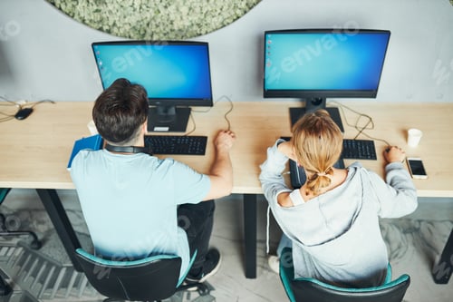 Preview: Students learning in computer classroom. Focused students studying for college exams