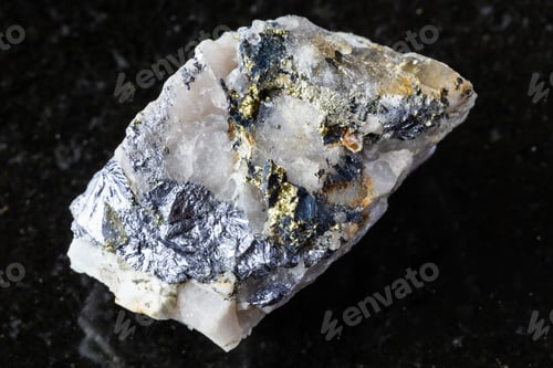 Preview: raw molybdenite and chalcopyrite in rock on black