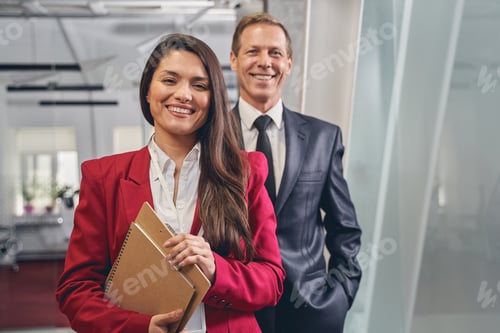 Preview: Pleased office workers looking straight at camera
