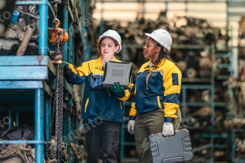 Preview: Two Female Technicians Inspecting Automotive Parts