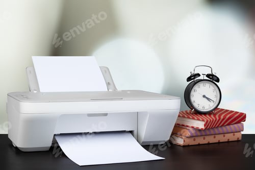 Preview: Compact home printer on desk with books against blurred background