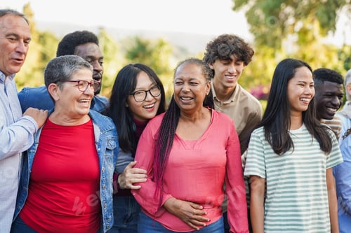 Preview: Crowd of multiracial people having fun together in front of camera outdoor