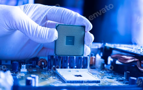 Preview: the scientist hand install the cpu processor in the motherboard socket and doing the research in lab