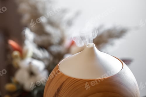Preview: Modern oil aroma diffuser close up on a blurred background.