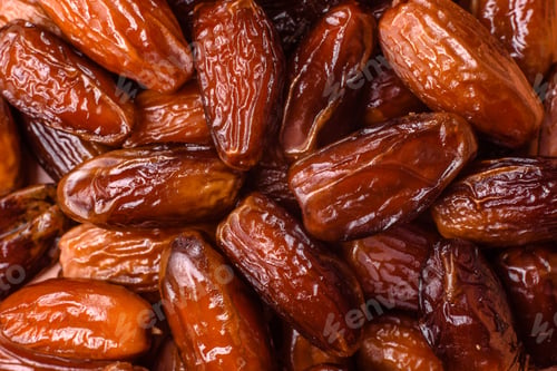 Preview: Dried dates on a ceramic plate for Ramadan or Iftar. Dates fruit as a background