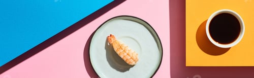 Preview: top view of fresh nigiri with shrimp near soy sauce on blue, pink, orange background, panoramic shot