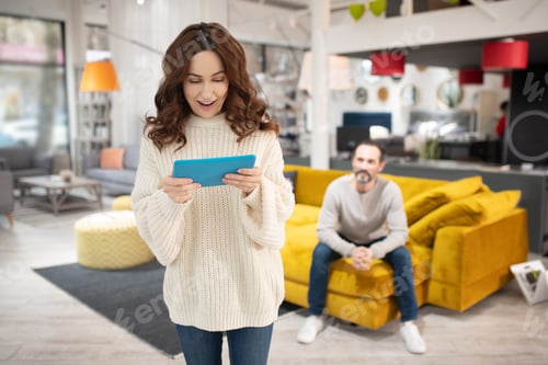 Preview: Woman with tablet in her hands surfing internet