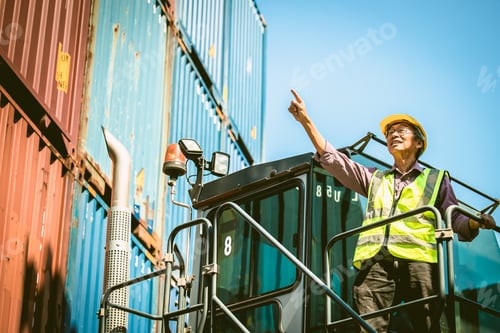 Preview: Asian senior elder worker working control load lifting cargo in transport shipping industry