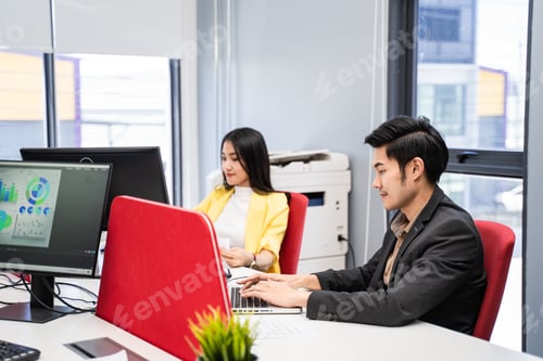 Preview: Group of Asian Attractive young business man and woman work on computer in office.