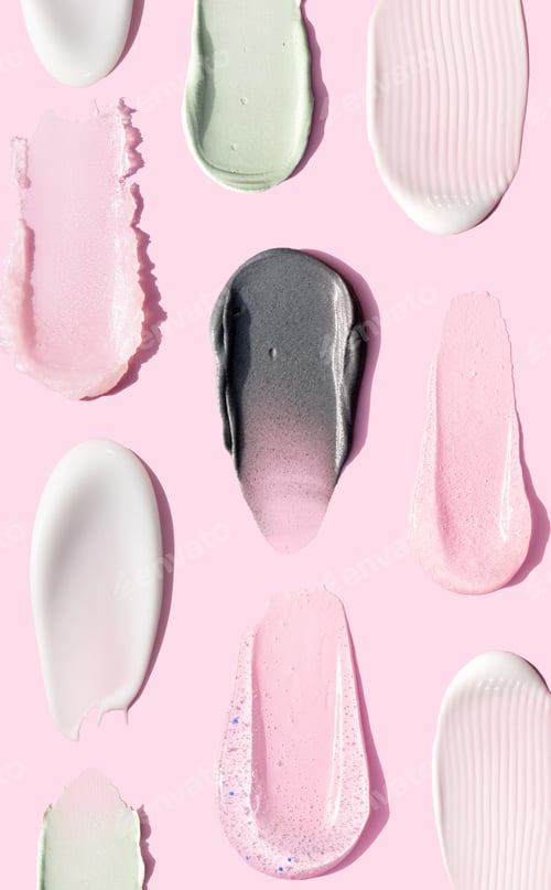 Preview: creamy texture of cosmetic samples on pink background