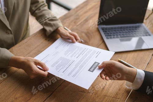 Preview: Close-up of business owner check resume of job applicants in company at the office.
