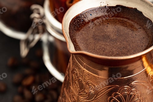 Preview: Coffee beans and turk on dark surface