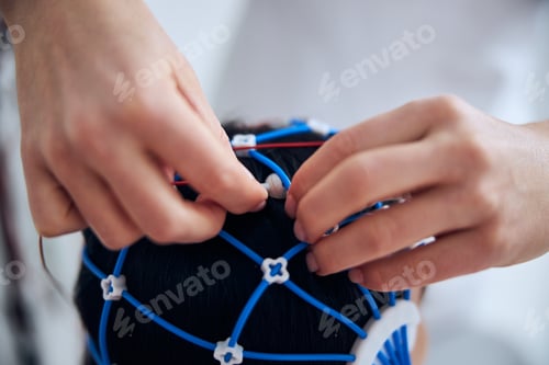 Preview: Patient in a silicone cap being prepared for a medical procedure