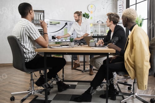 Preview: Businessmen partners sitting at desk. Business conference concept.