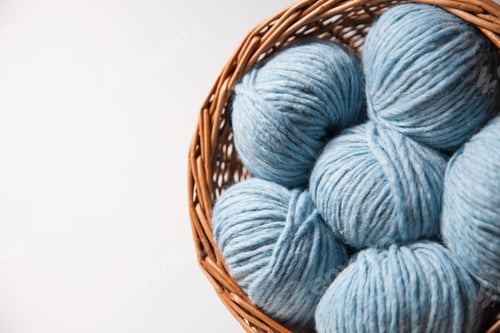 Preview: Soft Blue Yarn Balls in Wicker Basket