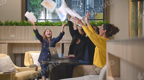 Preview: Group of happy business people celebrating success in office. Business success concept.