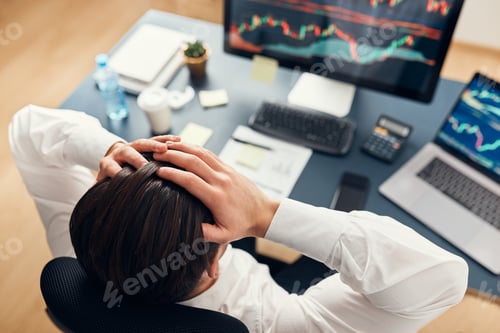Preview: Worried businessman looking at charts stressed by news from stock market. Trader lost money online