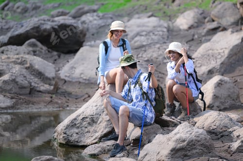 Preview: A group of friends going hiking in the streams of the tropical forest area.
