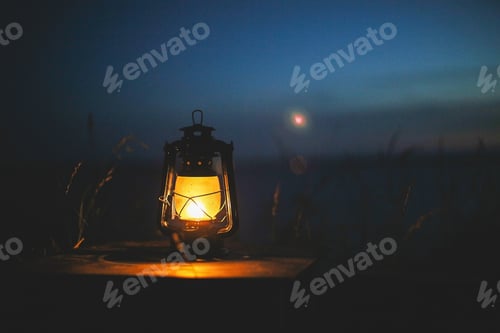 Preview: The lantern stands against the background of the night sky. Nice night photo. Glowing lantern