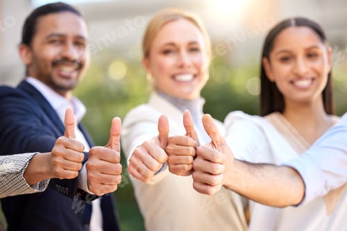 Preview: Shot of a group of businesspeople showing a thumbs up against a city background