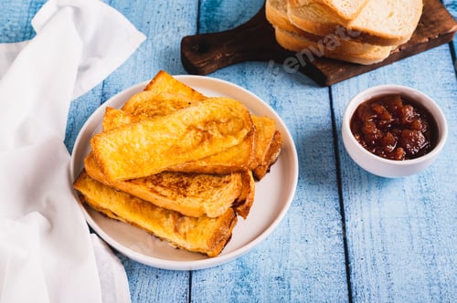 Preview: Traditional fried french toasts on white plate on table