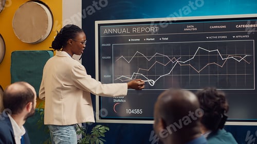 Preview: Marketing assistant presenting infographics in a status update meeting
