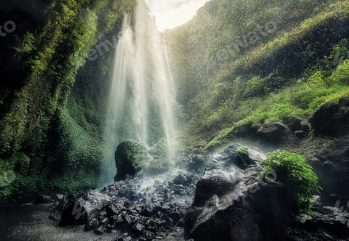 Preview: Beautiful Madakaripura waterfall flowing on rocky in creek
