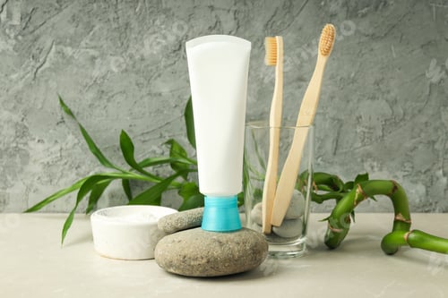 Preview: Concept of tooth care against gray textured background