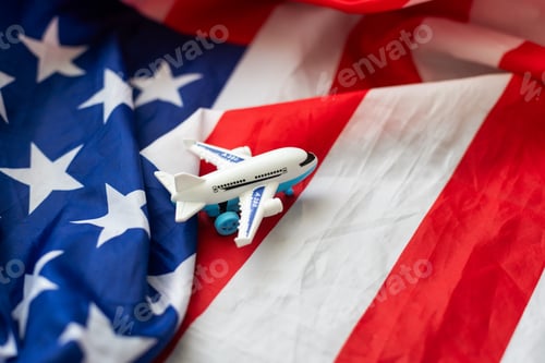 Preview: Travel in United States of America. Blank commercial airplane with four engines, on USA flag