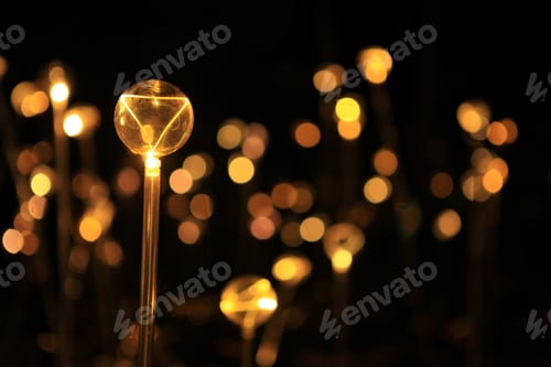 Preview: Closeup shot of a lamp on background of bokeh lights in the night