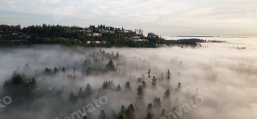 Preview: Residential Homes on top of mountain with fog. Sunset.