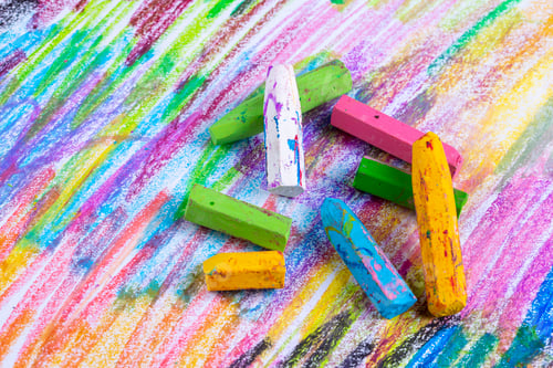 Preview: Colorful pastel crayons with painting background
