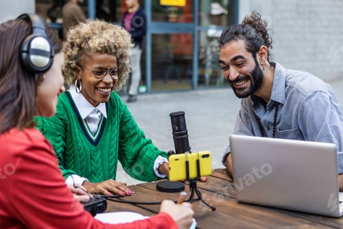 Preview: Diverse adult students recording podcast outdoor