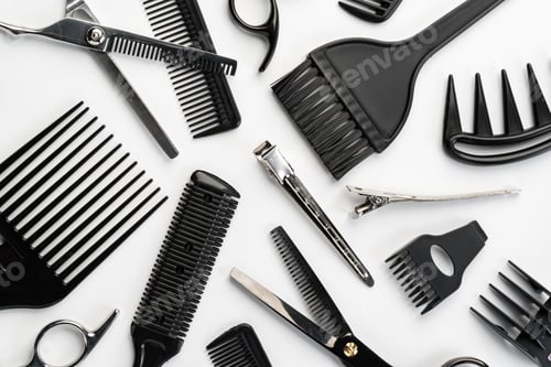 Preview: Black hairdressing tools and various hairbrushes on white background