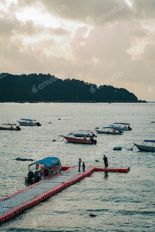 Preview: Colourful boats near the floating jetty in Perhentian Island in the morning.