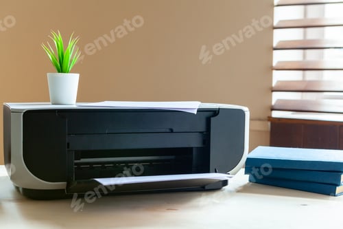 Preview: Close up of an office table with printer on it