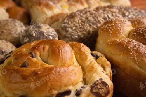 Preview: Variety of delicious pastries and bread buns on the table