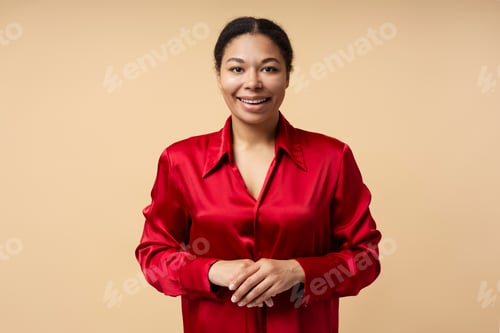 Preview: Beautiful smiling African American woman looking at camera isolated