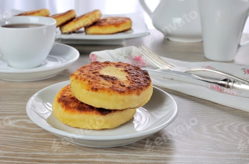 Preview: cheese pancakes for breakfast with a cup of coffee