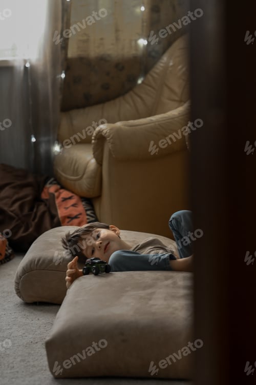 Preview: The boy at home plays toys