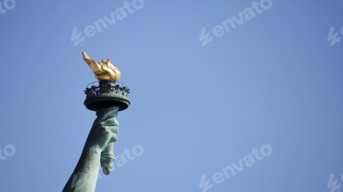 Preview: Famous torch of the statue of Liberty against the blue sky in New York