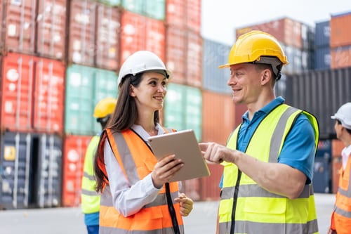 Preview: Caucasian businesswomen and man worker work in container port terminal.