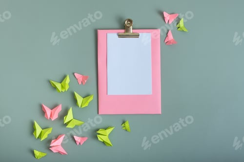Preview: Massage board mockup with paper butterflies green and pink color flat lay on a colored background