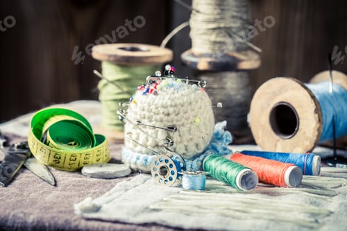 Preview: Closeup of vintage threads and tailor tape in workshop
