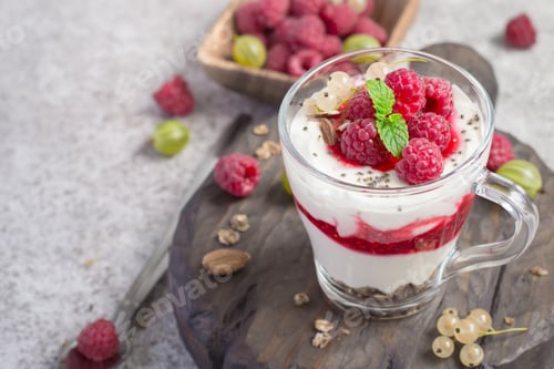 Preview: glass with raspberries, granola and yogurt arranged in layers