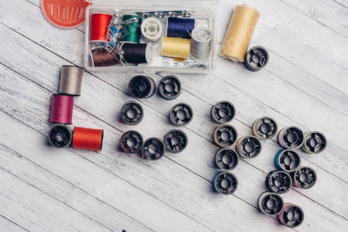 Preview: multicolored threads arranged in a certain order word love needlework needles pins