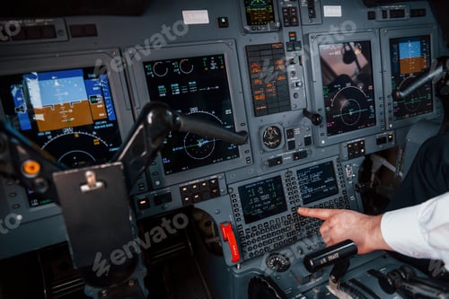 Preview: Close up view. Pilot on the work in the passenger airplane. Preparing for takeoff